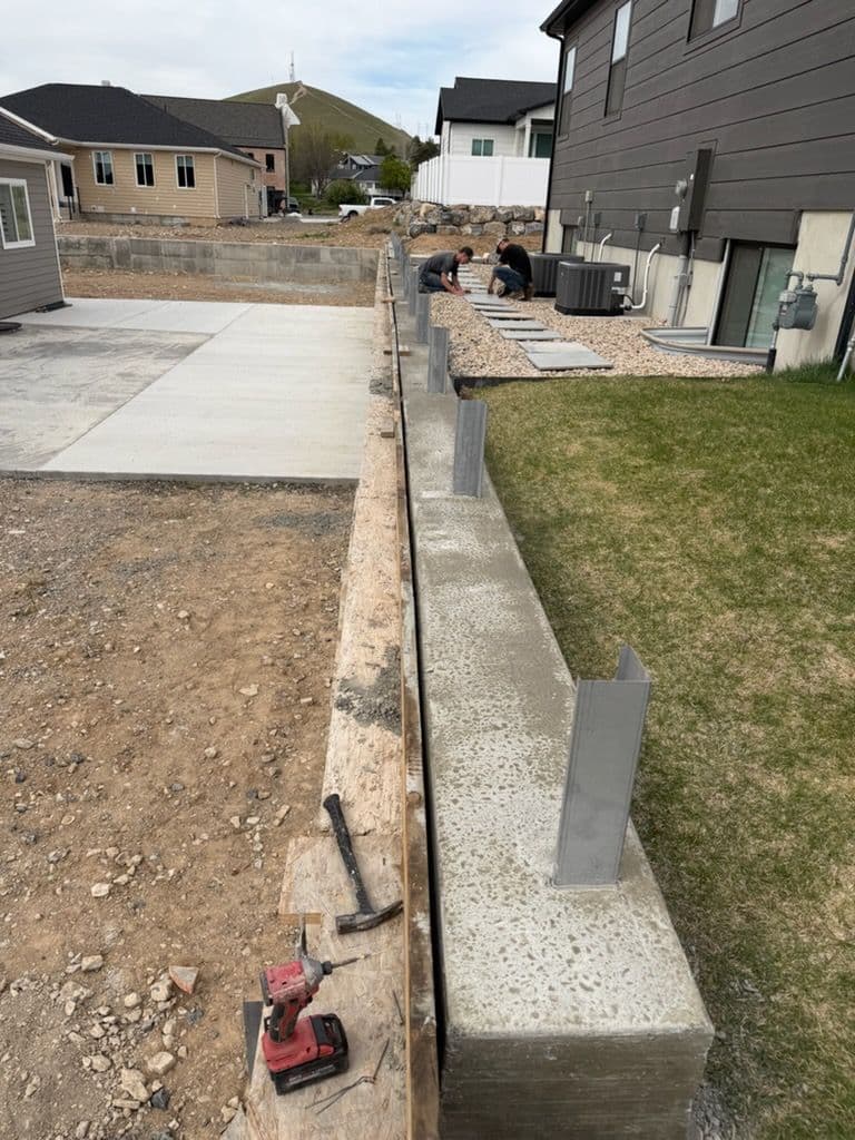 Gallery photos for Wall Height Addition Sets Up a Clean fence Line: Image #1