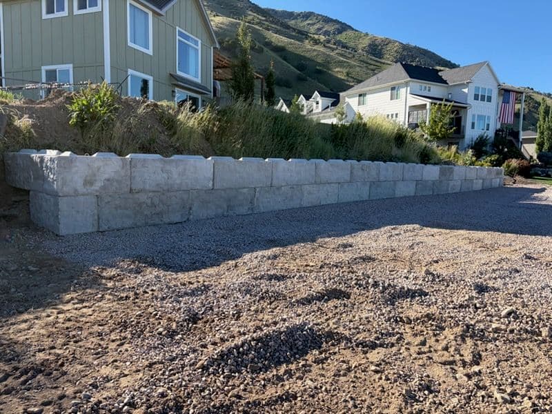Stamped Precast Concrete Block Retaining Wall Built to Hold image