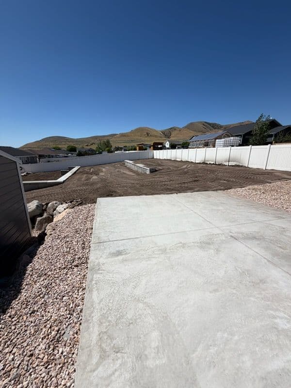 Gallery photos for Backyard Gets Structure With a Retaining Wall and Concrete Patio: Image #2